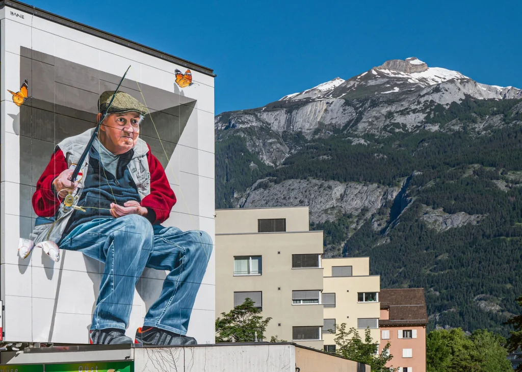Der Fischer: An der Plessur verewigte Fabian «Bane» Florin den Churer Fredy Dekumbis mit einem grossen, dreidimensional anmutenden Mural. 

